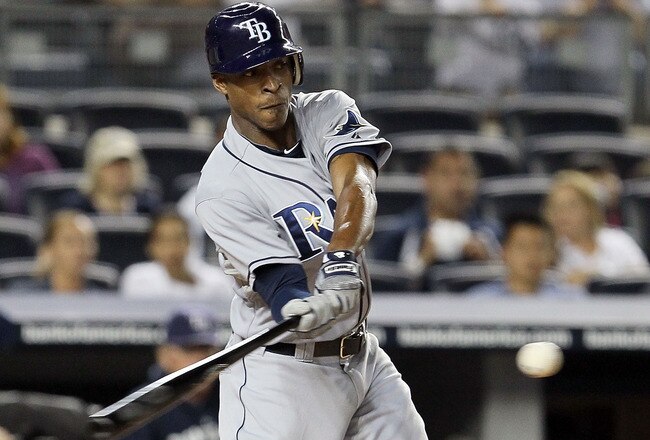 NEW YORK, NY - SEPTEMBER 22:  B.J. Upton #2 of the Tampa Bay Rays connects on a second-inning RBI triple against the New York Yankees on September 22, 2011 at Yankee Stadium in the Bronx borough of New York City.  (Photo by Jim McIsaac/Getty Images)