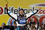 JOLIET, IL - JULY 10:  David Reutimann, driver of the #00 TUMS Toyota, celebrates in victory lane after he won the NASCAR Sprint Cup Series LIFELOCK.COM 400 at the Chicagoland Speedway on July 10, 2010 in Joliet, Illinois.  (Photo by Chris Trotman/Getty Images for NASCAR)