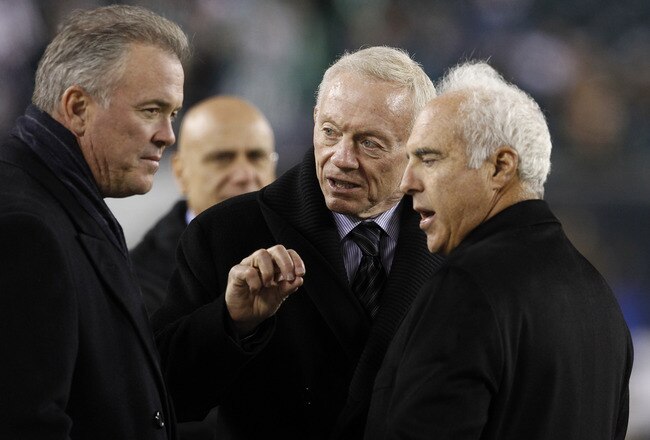 PHILADELPHIA, PA - OCTOBER 30: Stephen Jones, Dallas Cowboys V.P. of Player Personal, his father, Cowboys owner Jerry Jones and Philadelphia Eagles owner Jeffrey Lurie ( left-right) talk before the start of their game at Lincoln Financial Field on October 30, 2011 in Philadelphia, Pennsylvania. (Photo by Rich Schultz /Getty Images)