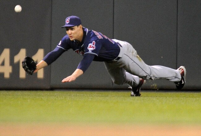 MINNEAPOLIS, MN - SEPTEMBER 16: Grady Sizemore #24 of the Cleveland Indians dives for a ball in center field against the Minnesota Twins in the ninth inning on September 16, 2011 at Target Field in Minneapolis, Minnesota. The Indians defeated the Twins 7-6. (Photo by Hannah Foslien/Getty Images)