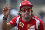 NOIDA, INDIA - OCTOBER 30:  Fernando Alonso of Spain and Ferrari attends the drivers parade before the Indian Formula One Grand Prix at the Buddh International Circuit on October 30, 2011 in Noida, India.  (Photo by Clive Mason/Getty Images)