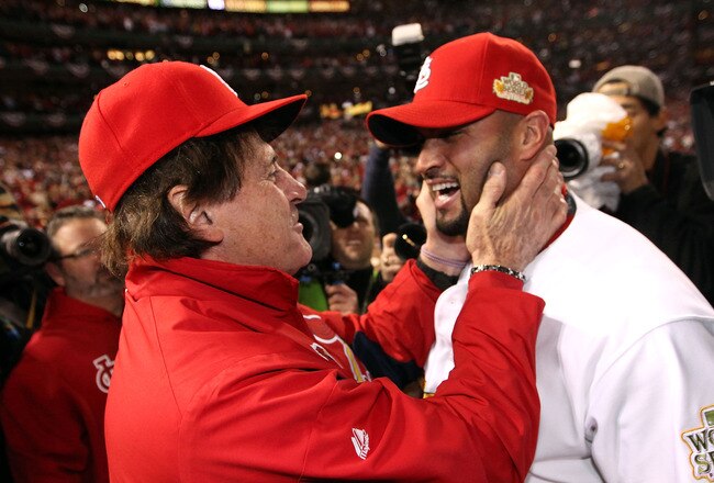 ST LOUIS, MO - OCTOBER 28:  (L-R) Manager Tony La Russa and Albert Pujols #5 of the St. Louis Cardinals celebrate after defeating the Texas Rangers 6-2 to win the World Series in Game Seven of the MLB World Series at Busch Stadium on October 28, 2011 in St Louis, Missouri.  (Photo by Jamie Squire/Getty Images)