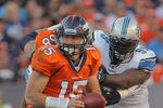 DENVER, CO - OCTOBER 30:  Quarterback Tim Tebow #15 of the Denver Broncos prepares to hand off the ball against the Detroit Lions at Sports Authority at Invesco Field at Mile High on October 30, 2011 in Denver, Colorado. The Lions defeated the Broncos 45-10.  (Photo by Doug Pensinger/Getty Images)