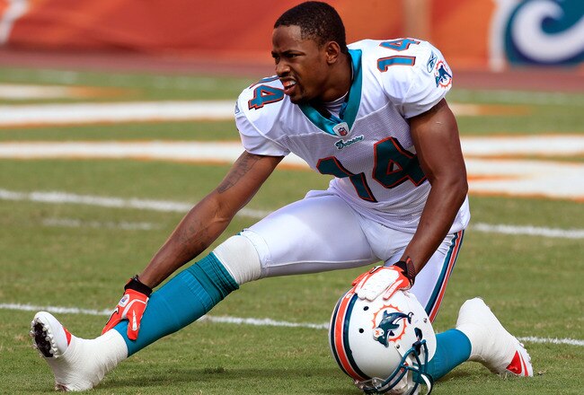 MIAMI GARDENS, FL - SEPTEMBER 18:  Miami Dolphins wide receiver Marlon Moore #14 warms up before the game against the Houston Texans at Sun Life Stadium on September 18, 2011 in Miami Gardens, Florida.  (Photo by Sam Greenwood/Getty Images)