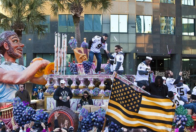 NEW ORLEANS - FEBRUARY 09: New Orleans Saints Quarterback Drew Brees #9 and teammates celebrate during the New Orleans Saints Super Bowl XLIV Victory Parade as they ride past the Louisiana Superdome on February 9, 2010 in New Orleans, Louisiana. (Photo by Skip Bolen/Getty Images)