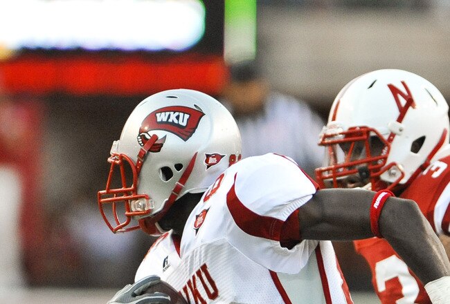 LINCOLN, NE - SEPTEMBER 04: Willie McNeal of the Western Kentucky Hilltoppers attempts to out run Jase Dean #31 of the Nebraska Cornhuskers after a mishandled punt during first half action of their game at Memorial Stadium on September 4, 2010 in Lincoln, Nebraska. Nebraska defeated Western Kentucky 49-10. (Photo by Eric Francis/Getty Images)