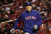 ST LOUIS, MO - OCTOBER 27: Derek Holland #45 of the Texas Rangers reacts after scoring on an RBI single by Ian Kinsler #5 in the seventh inning during Game Six of the MLB World Series against the St. Louis Cardinals at Busch Stadium on October 27, 2011 in St Louis, Missouri.  (Photo by Ezra Shaw/Getty Images)