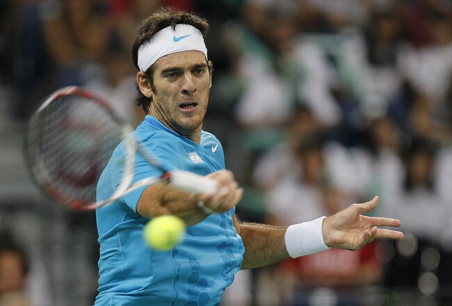 BELGRADE, SERBIA - SEPTEMBER 16: Juan Martin Del Potro of Argentina returns a shot to Janko Tipsarevic of Serbia during the Davis Cup singles semi final between Serbia and Argentina, at Belgrade Arena on September 16, 2011 in Belgrade, Serbia. (Photo by Srdjan Stevanovic/Getty Images)