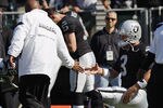OAKLAND, CA - OCTOBER 23: Head coach Hue Jackson of the Oakland Raiders slaps hands with quarterback Carson Palmer #3 before a game against the Kansas City Chiefs on October 23, 2011 at O.co Coliseum in Oakland, California. The Chiefs won 28-0. (Photo by Brian Bahr/Getty Images)