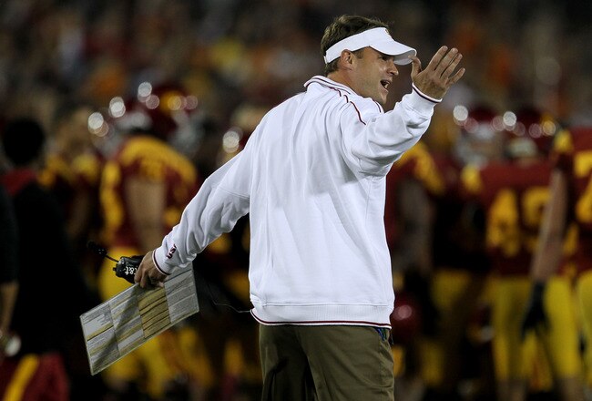 LOS ANGELES, CA - OCTOBER 29:  Head caoch Lane Kiffin of the USC Trojans complains to an official in the game with the Stanford Cardinal at the Los Angeles Memorial Coliseum on October 29, 2011 in Los Angeles, California. Stanford won 56-48 in three overtimes.  (Photo by Stephen Dunn/Getty Images)