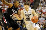 LAS VEGAS, NV - MARCH 12:  Jimmer Fredette #32 of the Brigham Young University Cougars drives agianst Billy White #32 of the San Diego State Aztecs during the championship game of the Conoco Mountain West Conference Basketball tournament at the Thomas & Mack Center March 12, 2011 in Las Vegas, Nevada. San Diego State won 72-54.  (Photo by Ethan Miller/Getty Images)