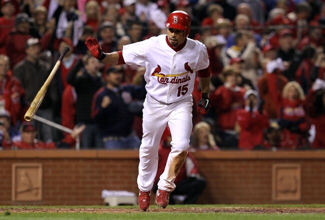 ST LOUIS, MO - OCTOBER 28:  Rafael Furcal #15 of the St. Louis Cardinals is hit by a pitch with the bases loaded to score Albert Pujols #5 in the fifth inning during Game Seven of the MLB World Series against the Texas Rangers at Busch Stadium on October 28, 2011 in St Louis, Missouri.  (Photo by Jamie Squire/Getty Images)