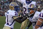 SOUTH BEND, IN - OCTOBER 30: John Flanders #21 of the Tulsa Golden Hurricane holds the ball after intercepting a pass in the end zone against the Notre Dame Fighting Irish as teammates Charles Davis #24 (center) and DeWitt Jennings #27 join the celebration at Notre Dame Stadium on October 30, 2010 in South Bend, Indiana. Tulsa defeated Notre Dame 28-27. (Photo by Jonathan Daniel/Getty Images)