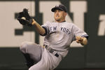 SEATTLE - SEPTEMBER 14:  Left fielder Brett Gardner #11 of the New York Yankees makes a sliding catch on a ball hit by Miguel Olivo #30 in the ninth inning against the Seattle Mariners at Safeco Field on September 14, 2011 in Seattle, Washington. (Photo by Otto Greule Jr/Getty Images)