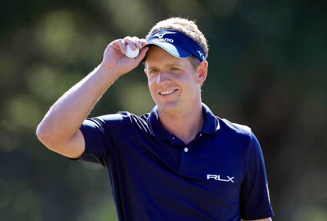LAKE BUENA VISTA, FL - OCTOBER 23:  Luke Donald of England acknowledges the crowd after making a birdie putt on the 13th hole during the final round of the Children's Miracle Network Classic at Disney's Magnolia course on October 23, 2011 in Lake Buena Vista, Florida.  (Photo by Sam Greenwood/Getty Images)