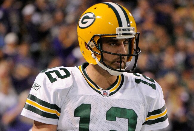 MINNEAPOLIS, MN - OCTOBER 23: Aaron Rodgers #12 of the Green Bay Packers reacts during the second half against the Minnesota Vikings on October 23, 2011 at Hubert H. Humphrey Metrodome in Minneapolis, Minnesota. The Packers defeated the Vikings 33-27. (Photo by Hannah Foslien/Getty Images)