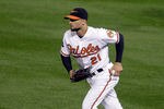 BALTIMORE, MD - SEPTEMBER 26: Right fielder Nick Markakis #21 of the Baltimore Orioles runs in after making a catch against the Boston Red Sox at Oriole Park at Camden Yards on September 26, 2011 in Baltimore, Maryland.  (Photo by Rob Carr/Getty Images)