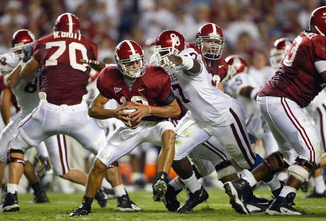 TUSCALOOSA, AL - SEPTEMBER 6: Quarterback Brodie Croyle #12 of the Alabama Crimson Tide is sacked by Tommie Harris #97 of the Oklahoma Sooners on September 6, 2003 in Tuscaloosa, Alabama. Oklahoma defeated Alabama 20-13. (Photo by Jamie Squire/Getty Images).