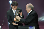 ZURICH - SWITZERLAND - DECEMBER 21:  Argentina's Lionel Messi receives the 2009 FIFA World Player Trophy from UEFA President Michel Platini and FIFA President Sepp Blatter during the FIFA World Player Gala 2009 at the Kongresshaus on December 21, 2009 in Zurich, Switzerland.  (Photo by Pascal Muller/Getty Images)