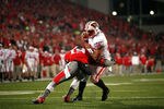 COLUMBUS, OH - OCTOBER 29:  Orhian Johnson #19 of the Ohio State Buckeyes tackles Russell Wilson #16 of the Wisconsin Badgers to prevent a touchdown during the third quarter on October 29, 2011 at Ohio Stadium in Columbus, Ohio. Ohio State defeated Wisconsin 33-29. (Photo by Kirk Irwin/Getty Images)