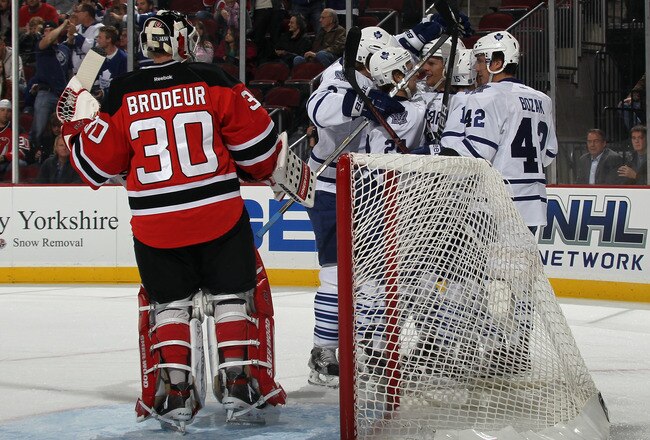 NEWARK, NJ - NOVEMBER 02: The Toronto Maple Leafs celebrate a score by Joey Crabb #46 at 8:37 of the first period against Martin Brodeur #30 of the New Jersey Devils at the Prudential Center on November 2, 2011 in Newark, New Jersey. (Photo by Bruce Bennett/Getty Images)