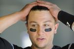 DENVER, CO - SEPTEMBER 10: Troy Tulowitzki #2 of the Colorado Rockies reacts in the dugout against the Cincinnati Reds  at Coors Field on September 10, 2011 in Denver, Colorado. Colorado beat Cincinnati 12-7.  (Photo by Jack Dempsey/Getty Images)