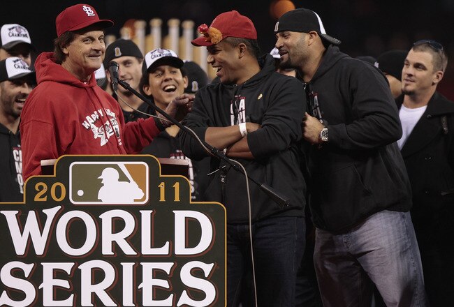 ST. LOUIS, MO - OCTOBER 30: Manager Tony La Russa (L-R) jokes with Octavio Dotel and Albert Pujols of the St. Louis Cardinals during a ceremony celebrating the team's 11th World Series championship October 30, 2011 in St. Louis, Missouri. (Photo by Whitney Curtis/Getty Images)