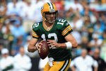 CHARLOTTE, NC - SEPTEMBER 18:  Aaron Rodgers #12 of the Green Bay Packers drops back to pass against the Carolina Panthers during their game at Bank of America Stadium on September 18, 2011 in Charlotte, North Carolina.  (Photo by Streeter Lecka/Getty Images)
