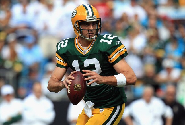 CHARLOTTE, NC - SEPTEMBER 18:  Aaron Rodgers #12 of the Green Bay Packers drops back to pass against the Carolina Panthers during their game at Bank of America Stadium on September 18, 2011 in Charlotte, North Carolina.  (Photo by Streeter Lecka/Getty Images)