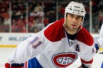 NEWARK, NJ - APRIL 02:  Scott Gomez #11 of the Montreal Canadians waits for a faceoff during an NHL hockey game against the New Jersey Devils at the Prudential Center on April 2, 2011 in Newark, New Jersey.  (Photo by Paul Bereswill/Getty Images)