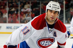 NEWARK, NJ - APRIL 02:  Scott Gomez #11 of the Montreal Canadians waits for a faceoff during an NHL hockey game against the New Jersey Devils at the Prudential Center on April 2, 2011 in Newark, New Jersey.  (Photo by Paul Bereswill/Getty Images)