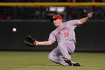 DENVER, CO - SEPTEMBER 09:  Rightfielder Jay Bruce #32 of the Cincinnati Reds makes a sliding catch on a soft fly ball by Jhoulys Chacin #45 of the Colorado Rockies to end the fourth inning at Coors Field on September 9, 2011 in Denver, Colorado.  (Photo by Doug Pensinger/Getty Images)