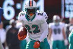 EAST RUTHERFORD, NJ - OCTOBER 30:  Reggie Bush #22 of the Miami Dolphins rushes against the New York Giants at MetLife Stadium on October 30, 2011 in East Rutherford, New Jersey.  (Photo by Nick Laham/Getty Images)