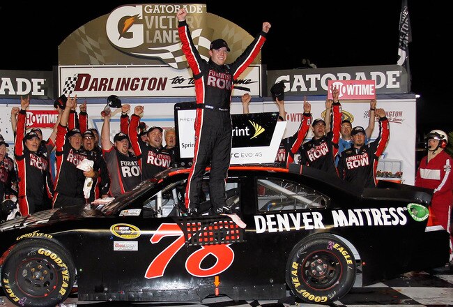 DARLINGTON, SC - MAY 07:  Regan Smith, driver of the #78 Furniture Row Companies Chevrolet, celebrates in Victory Lane after winning the NASCAR Sprint Cup Series SHOWTIME Southern 500 at Darlington Raceway on May 7, 2011 in Darlington, South Carolina.  (Photo by Geoff Burke/Getty Images for NASCAR)