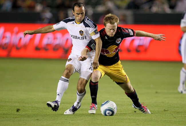 CARSON, CA - NOVEMBER 03:  Dax McCarty #11 of the New York Red Bulls fights for the ball with Landon Donovan #10 of the Los Angeles Galaxy in their Western Conference Semifinal at The Home Depot Center on September 9, 2011 in Carson, California.  (Photo by Stephen Dunn/Getty Images)