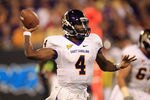 CHARLOTTE, NC - SEPTEMBER 03:  Dominique Davis #4 of the East Carolina Pirates drops back to pass against the South Carolina Gamecocks during their game at Bank of America Stadium on September 3, 2011 in Charlotte, North Carolina.  (Photo by Streeter Lecka/Getty Images)