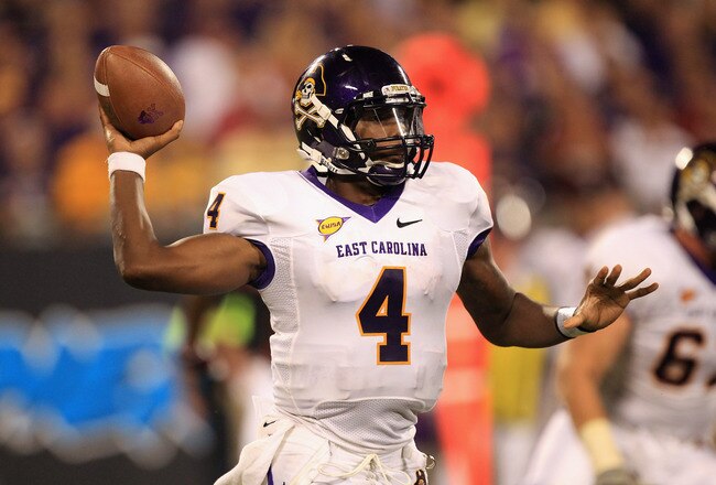 CHARLOTTE, NC - SEPTEMBER 03:  Dominique Davis #4 of the East Carolina Pirates drops back to pass against the South Carolina Gamecocks during their game at Bank of America Stadium on September 3, 2011 in Charlotte, North Carolina.  (Photo by Streeter Lecka/Getty Images)