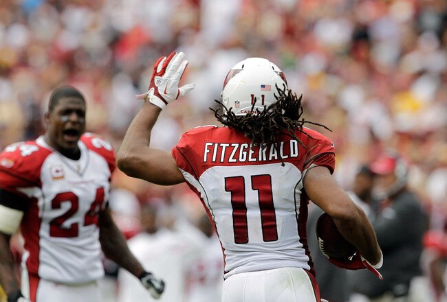 LANDOVER, MD - SEPTEMBER 18:  Wide receiver Larry Fitzgerald #11 of the Arizona Cardinals reacts after scoring a touchdown against the Washington Redskins during the second half at FedExField on September 18, 2011 in Landover, Maryland. Washington defeated the Arizona 22-21.  (Photo by Rob Carr/Getty Images)