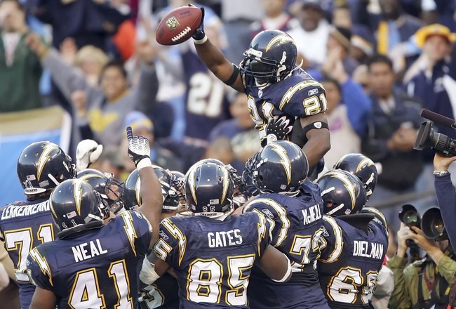 SAN DIEGO - DECEMBER 10:  LaDainian Tomlinson #21 of the San Diego Chargers celebrates with teammates after breaking the NFL record for single-season touchdowns, with 29 touchdowns, against the Denver Broncos December 10, 2006 at Qualcomm Stadium in San Diego, California.  (Photo by Lisa Blumenfeld/Getty Images)