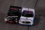 FORT WORTH, TX - NOVEMBER 04:  Kyle Busch, driver of the #18 Traxxas Toyota, collides with Ron Hornaday Jr., driver of the #33 OneMain Financial Chevrolet, during the NASCAR Camping World Truck Series WinStar World Casino 350k at Texas Motor Speedway on November 4, 2011 in Fort Worth, Texas.  (Photo by Tom Pennington/Getty Images for NASCAR)