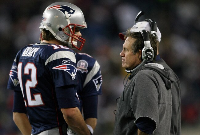 FOXBORO, MA - NOVEMBER 22:  Tom Brady #12 of the New England Patriots talks with head coach Bill Belichick in fourth quarter against the New York Jets on November 22, 2009 at Gillette Stadium in Foxboro, Massachusetts. The Patriots defeated the Jets 31-14.  (Photo by Elsa/Getty Images)