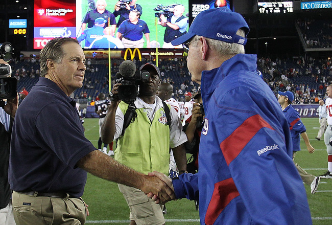FOXBORO, MA - SEPTEMBER 1:  Bill Belichick of the New England shakes hands with Tom Coughlin of the New York Gianst  after a preseason game at Gillette Stadium on September 1, 2011 in Foxboro, Massachusetts. (Photo by Jim Rogash/Getty Images)