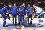 ST. LOUIS, MO - NOVEMBER 4: David Freese, Chris Carpenter and Tony LaRussa all of the St. Louis Cardinals watch as Carpenter's son Sam Carpenter drops the puck for David Backes #42 of the St. Louis Blues and Henrik Sedin #33 of the Vancouver Canucks at the Scottrade Center  on November 4, 2011 in St. Louis, Missouri.  The Blues beat Canucks 3-2.  (Photo by Dilip Vishwanat/Getty Images)
