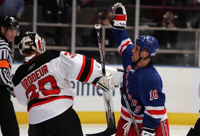 NEW YORK - APRIL 13: Sean Avery #16 of the New York Rangers tries to screen Martin Brodeur #30 of the New Jersey Devils during game three of the 2008 NHL Eastern Conference Quarterfinals on April 13, 2008 at Madison Square Garden in New York City.  (Photo by Jim McIsaac/Getty Images)