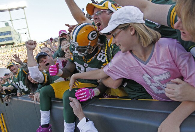 GREEN BAY, WI - OCTOBER 2: James Jones #89 of the Green Bay Packers does a Lambeau Leap after scoring a touchdown against the Denver Broncos at Lambeau Field on October 2, 2011 in Green Bay, Wisconsin.  (Photo by Matt Ludtke /Getty Images)