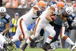 CLEVELAND, OH - OCTOBER 2:  Runingback Peyton Hillis #40 of the Cleveland Browns is tackled by defensive end Dave Ball #98 of the Tennessee Titans during the second quarter at Cleveland Browns Stadium on October 2, 2011 in Cleveland, Ohio. (Photo by Jason Miller/Getty Images)