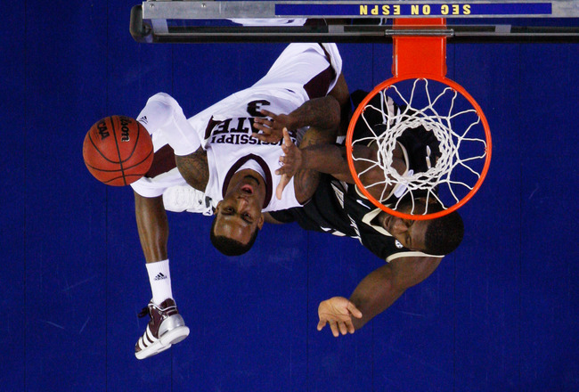 ATLANTA, GA - MARCH 11:  Dee Bost #3 of the Mississippi State Bulldogs shoots against Festus Ezeli #3 of the Vanderbilt Commodores during the quarterfinals of the SEC Men's Basketball Tournament at Georgia Dome on March 11, 2011 in Atlanta, Georgia. The Commodores defeated the Bulldogs 87 to 81.  (Photo by Kevin C. Cox/Getty Images)