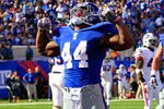 EAST RUTHERFORD, NJ - OCTOBER 16:  (EDITORS NOTE: Retransmission with alternate crop.) Ahmad Bradshaw #44 of the New York Giants celebrates a touchdown in the second quarter against the Buffalo Bills at MetLife Stadium on October 16, 2011 in East Rutherford, New Jersey.  (Photo by Chris Trotman/Getty Images)