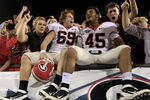 JACKSONVILLE, FL - OCTOBER 29:  Georgia Bulldog players celebrate with fans following a win over the Florida Gators 24-20 at EverBank Field on October 29, 2011 in Jacksonville, Florida.  (Photo by Sam Greenwood/Getty Images)