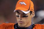 DENVER, CO - SEPTEMBER 12:  Quarterback Brady Quinn #9 of the Denver Broncos looks on from the bench against the Oakland Raiders at Sports Authority Field at Mile High on September 12, 2011 in Denver, Colorado. The Raiders defeated the Broncos 23-20.  (Photo by Doug Pensinger/Getty Images)